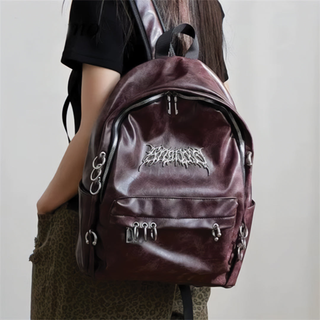Sac À Dos Rebel Chrome Amawinc Cuir Végan Avec Cercles Métalliques Accrocheurs Et Fermetures À Glissière Sécurisées
