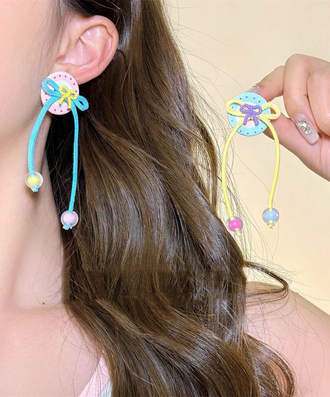 Boucles d'oreilles pendantes à pompon et nœud papillon arc-en-ciel faites à la main - Amawinc