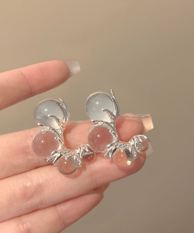 Boucles d'oreilles créoles asymétriques en résine cuivrée et nude modernes en forme de C - Amawinc