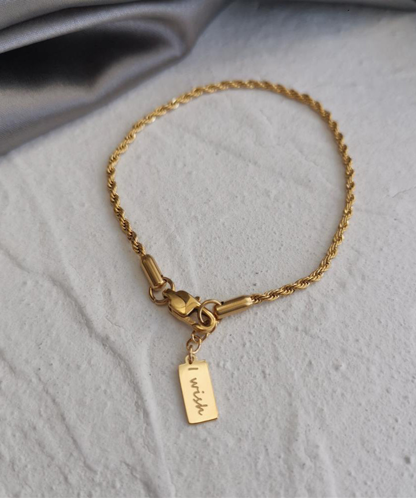Bracelet à breloques torsadées en alliage de cuivre doré au design original avec pompons - Amawinc