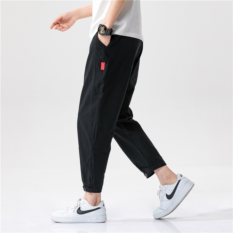 Pantalon Yuzuki En Lin À Coupe Tapered Moderne Avec Tissu Léger Et Design Minimaliste Accent Rouge Discret
