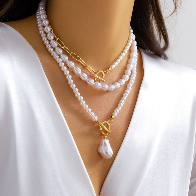 Collier Multicouches Solane Avec Perles Et Chaînes Audacieuses Design Sculpté Pour Décolleté Élégant