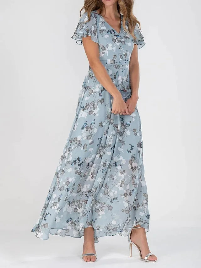 Quilla Kleid: Blumendruck und modisches Design