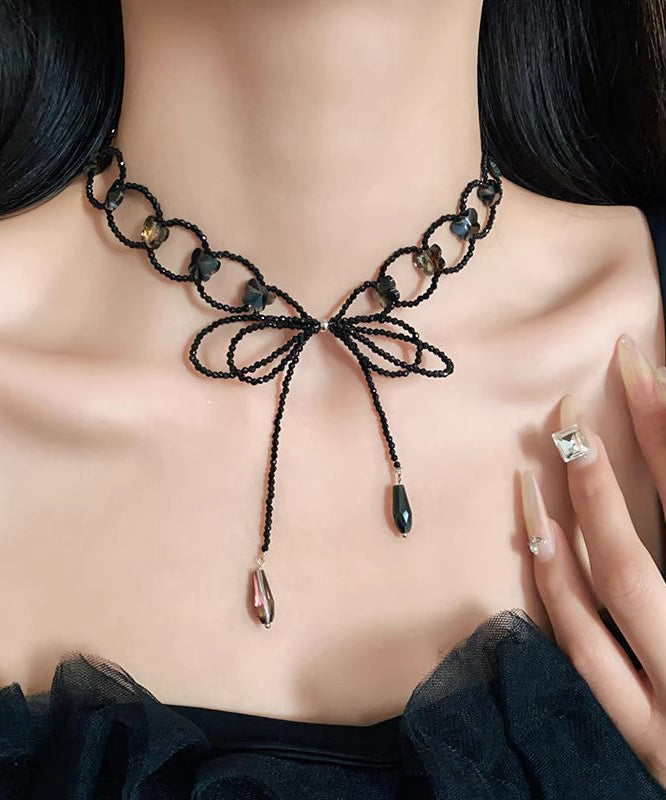 Collier sautoir ajouré à nœud papillon noir tissé - Amawinc