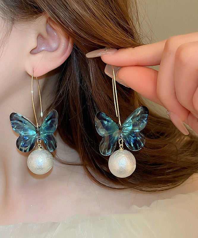 Boucles d'oreilles créoles en acrylique bleu avec perles et papillon - Amawinc