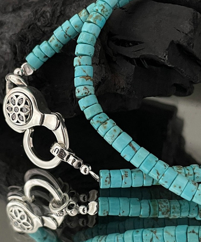 Collier avec pendentif en forme de fleurs de cerisier en acier inoxydable et perles turquoises - Amawinc
