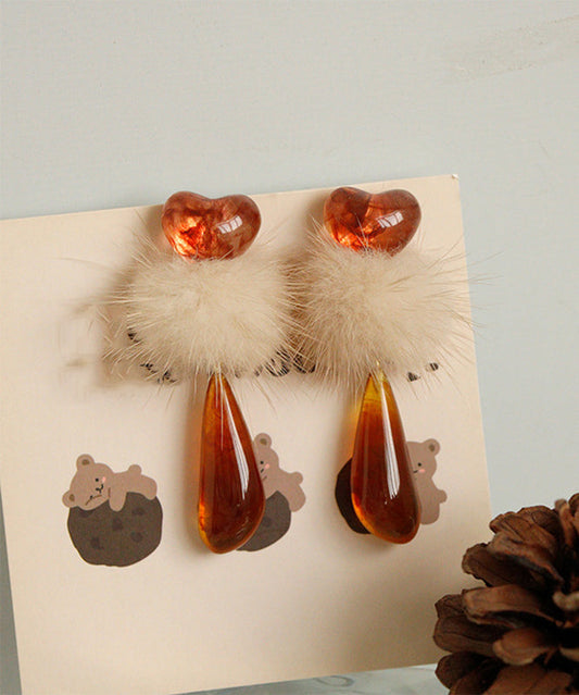 Boucles d'oreilles pendantes chics en résine plastique orange avec boules pelucheuses décorées - Amawinc
