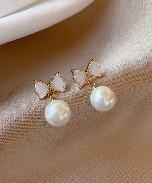 Boucles d'oreilles pendantes élégantes en alliage de cuivre blanc avec nœud en perles de coquillage - Amawinc