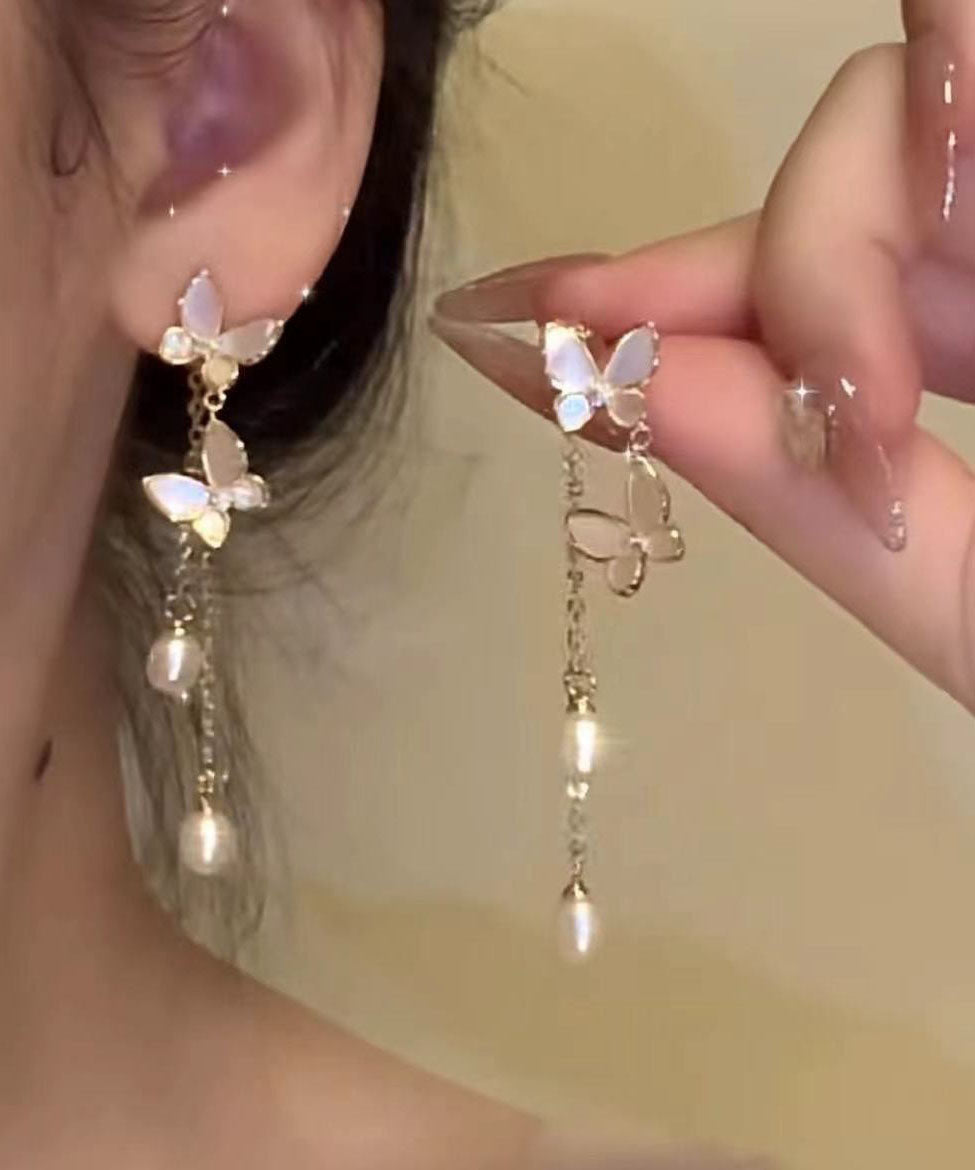 Boucles d'oreilles pendantes modernes en alliage de cuivre doré et perles, motif papillon et pompon - Amawinc