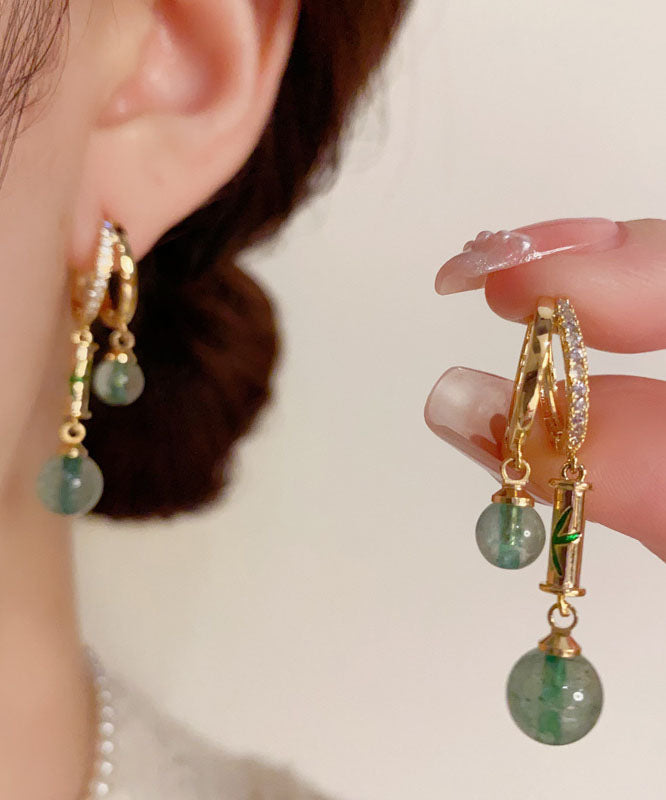 Boucles d'oreilles pendantes rétro en zircon doré et cuivre, serties de pierres précieuses et ornées d'un motif bambou. - Amawinc