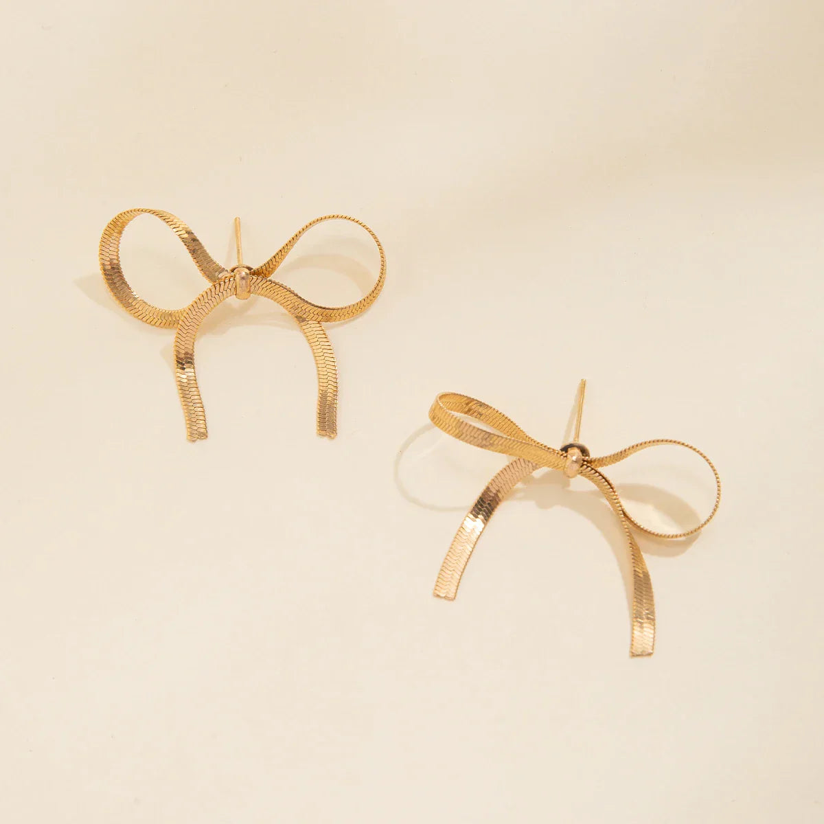 Boucles Doreilles Nœud Ange Or Et Argent Avec Franges Striées Charme Mémoire Et Célébration