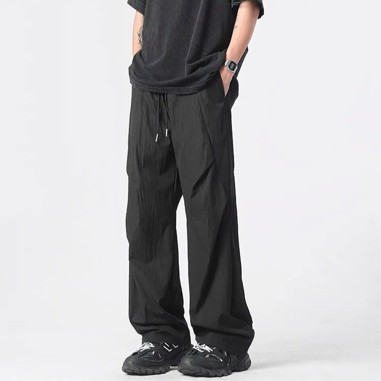 Pantalon Parachute Tufté En Nylon Léger Froissé Avec Cordons Chromés Et Coupe Large Décontractée