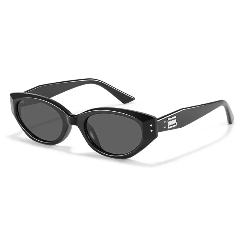 Lunettes Vestra Noir Cadre Acétate Brut Lentilles Ovales UV Protection Détail Logo Métal Design Contemporain