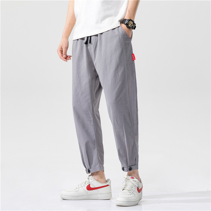 Pantalon Yuzuki En Lin À Coupe Tapered Moderne Avec Tissu Léger Et Design Minimaliste Accent Rouge Discret
